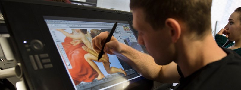 a student works on a graphic design project
